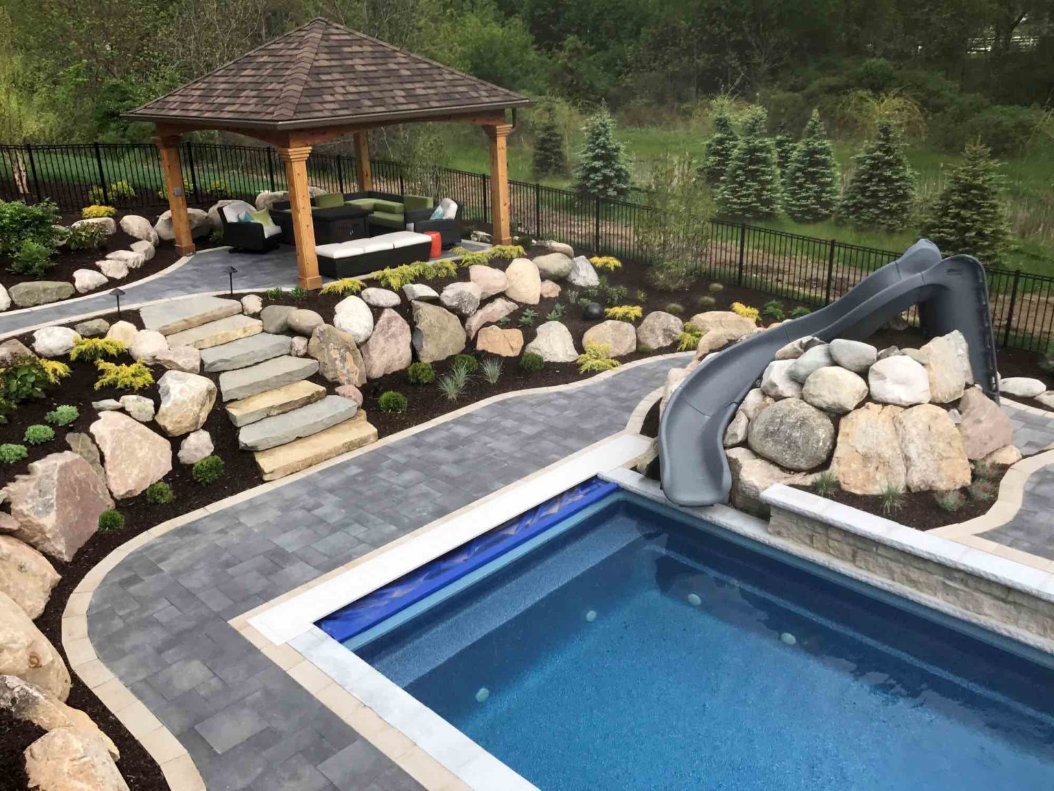luxurious inground pool contractor in Northville, MI Rectangle fiberglass pool custom pools and spas Outdoor living space Custom inground pools Backyard pool ideas detroit Outdoor living contractor oak Outdoor living Northville mi pool and spa design Metro Detroit Metro Detroit pool and spa experts Custom pool design Metro Detroit Spa installation in Metro Detroit Metro Detroit outdoor spa design Residential pool design Metro Detroit