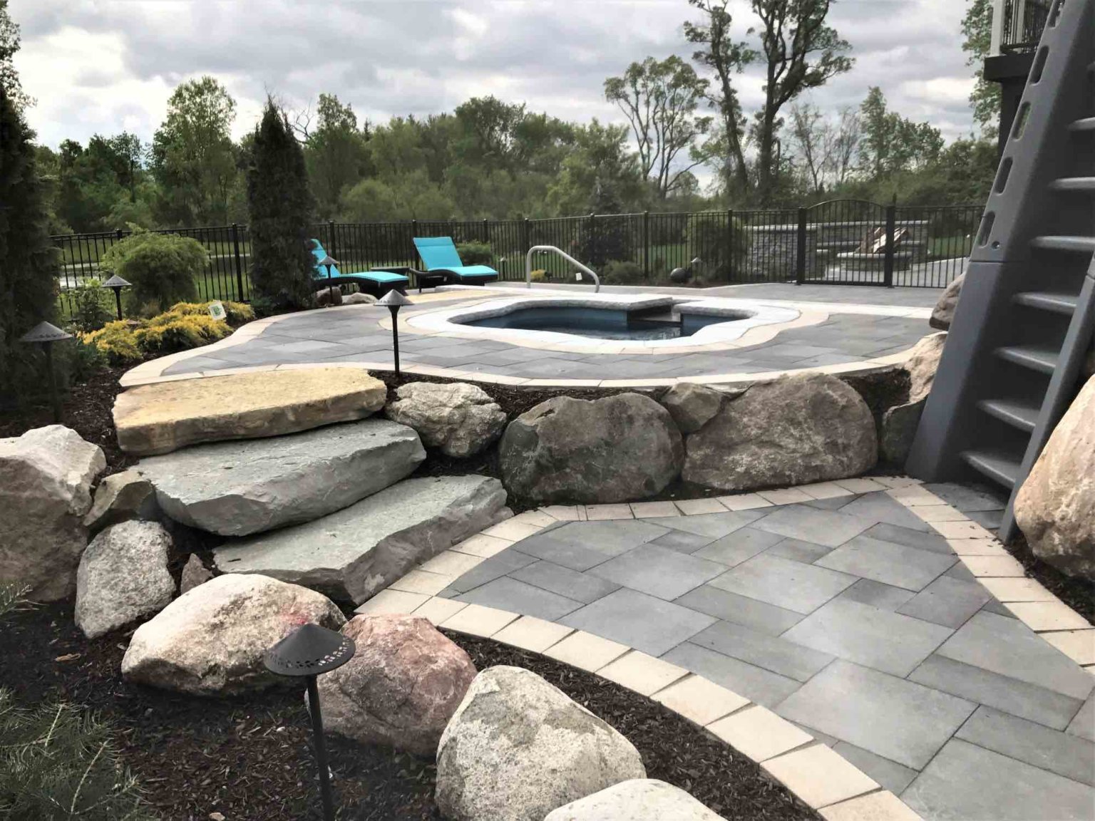luxurious inground pool contractor in Northville, MI Pool and cascade spa michigan Outdoor living space Michigan Landscape Design Landscape Design Services in Michigan Professional Landscape Design Michigan Michigan Landscape Architects Best Landscape Designers in Michigan Michigan Residential Landscape Design Custom Landscape Design Michigan Michigan Garden Design