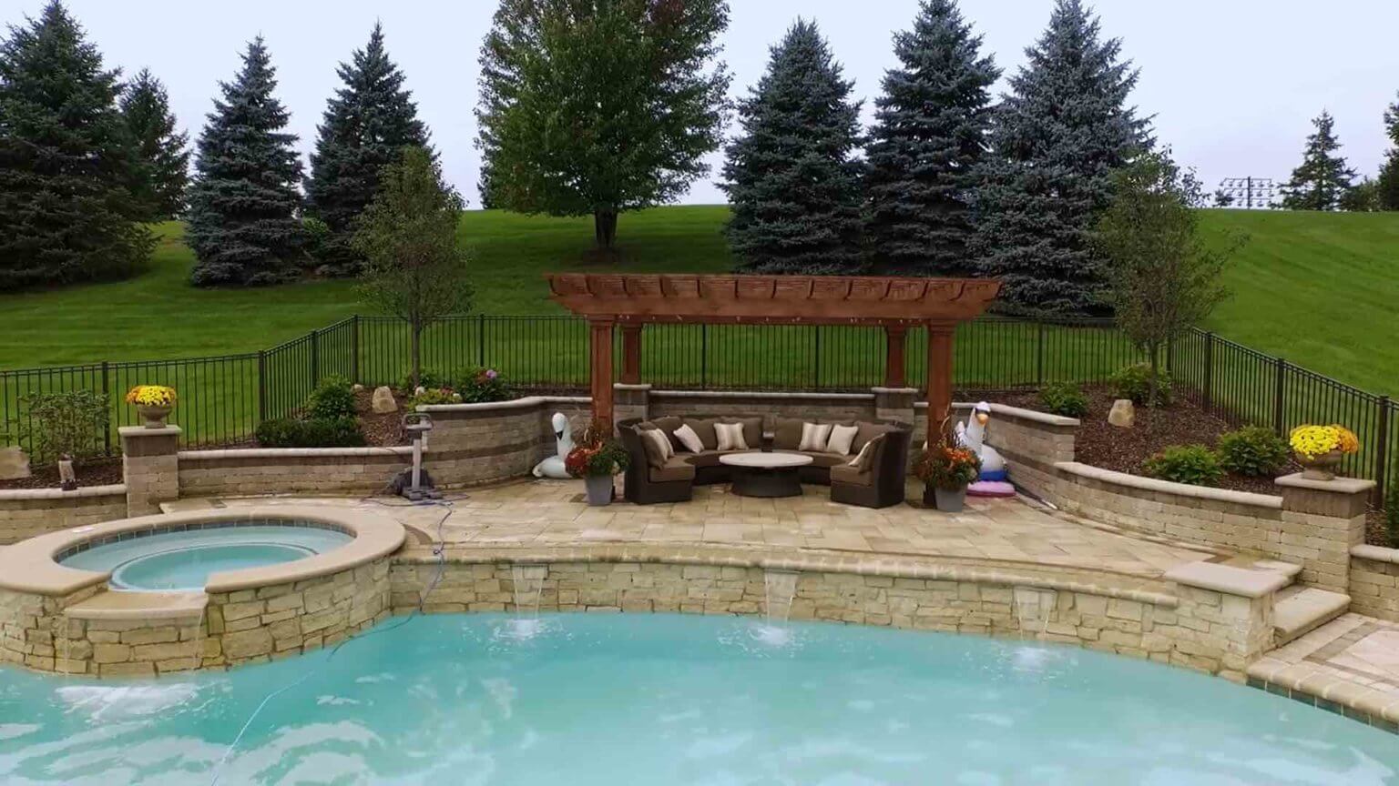 poolside seating and spillover spa connecting into pool
