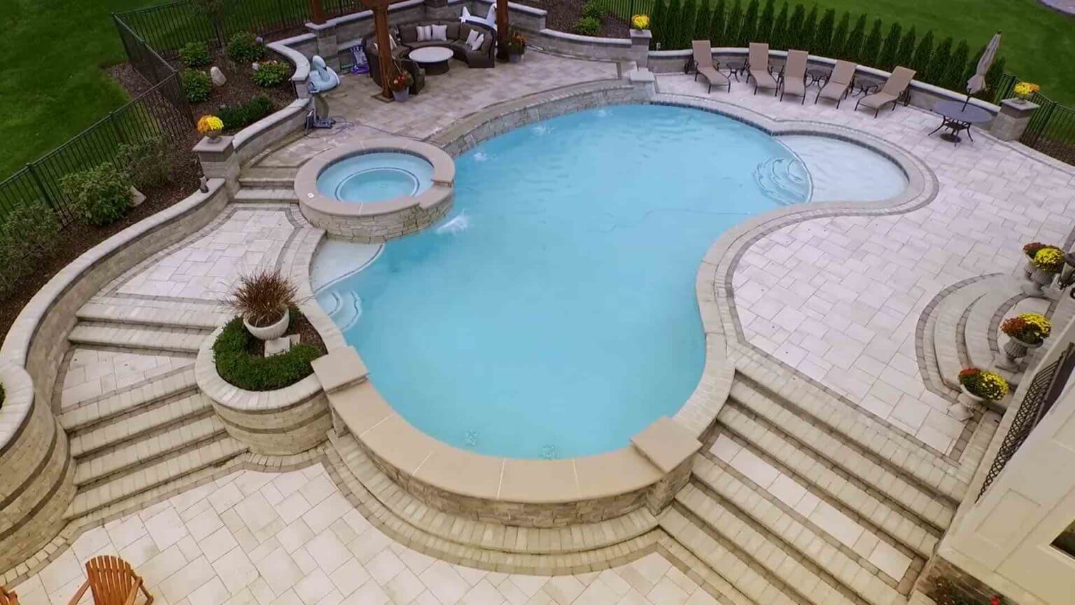 view from above of pool with spillover spa