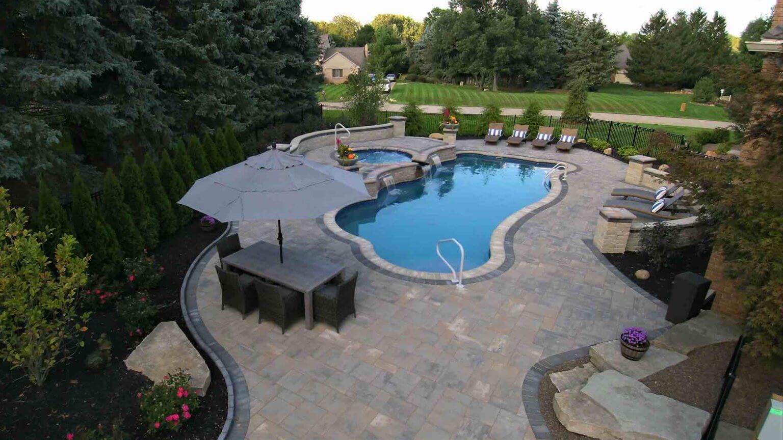 pool with spillover hot tub