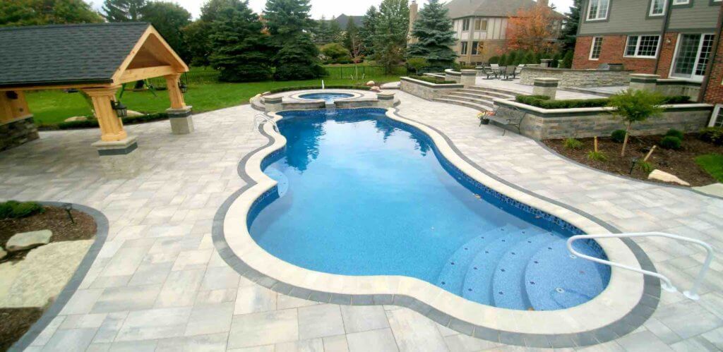 pool lighting, pool lights, pool inspo, bricks paving, paver patios, pool and spa, organic pool, brick pavers