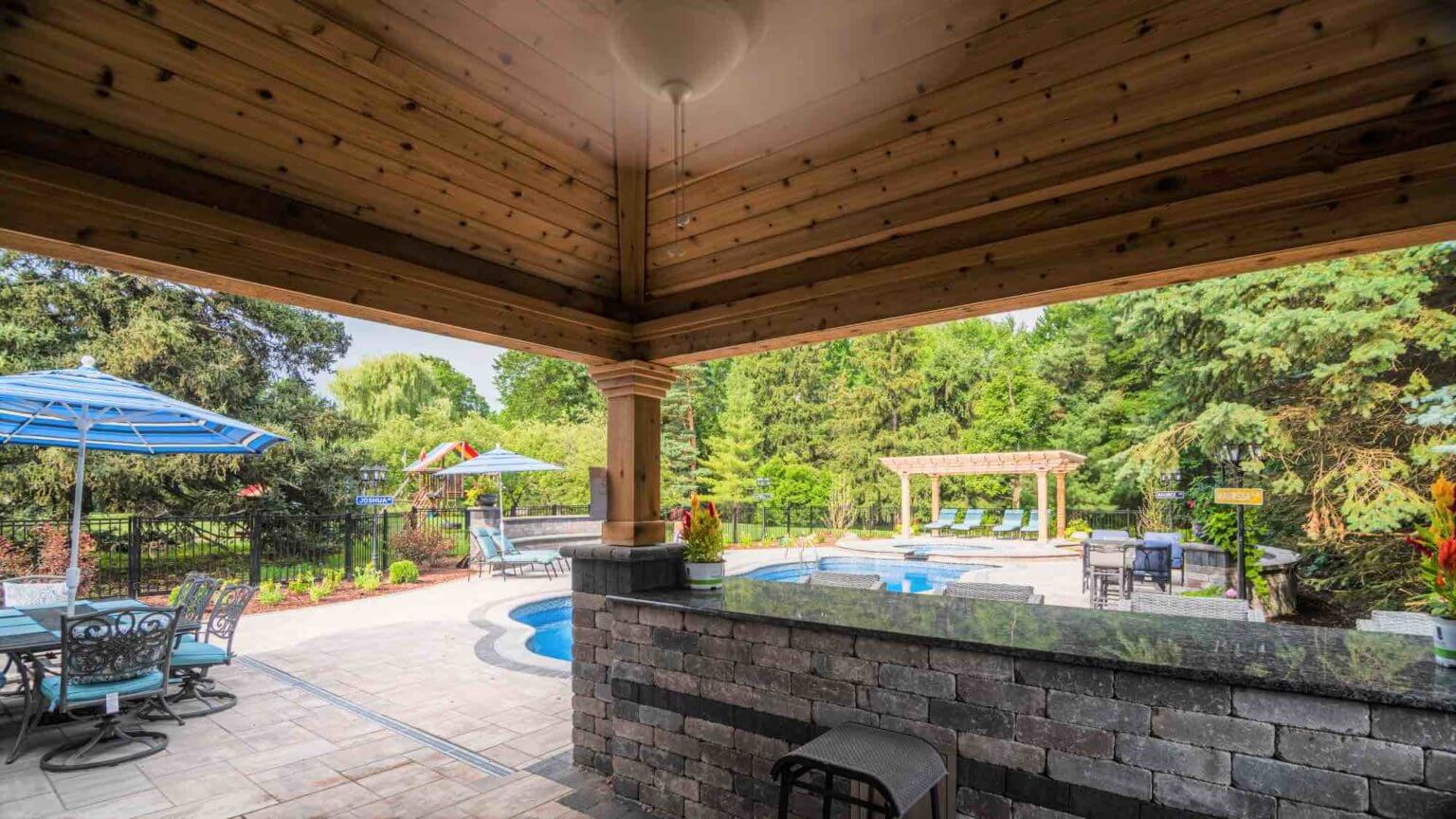 view of pool from outdoor kitchen
