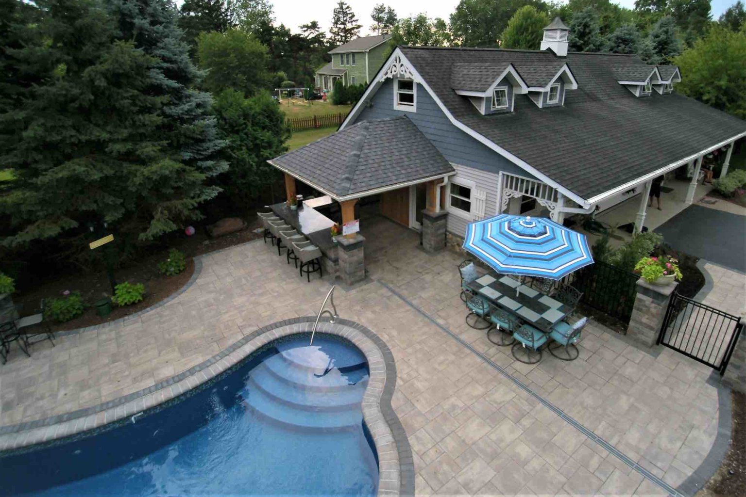 aerial view of poolside outdoor kitchen