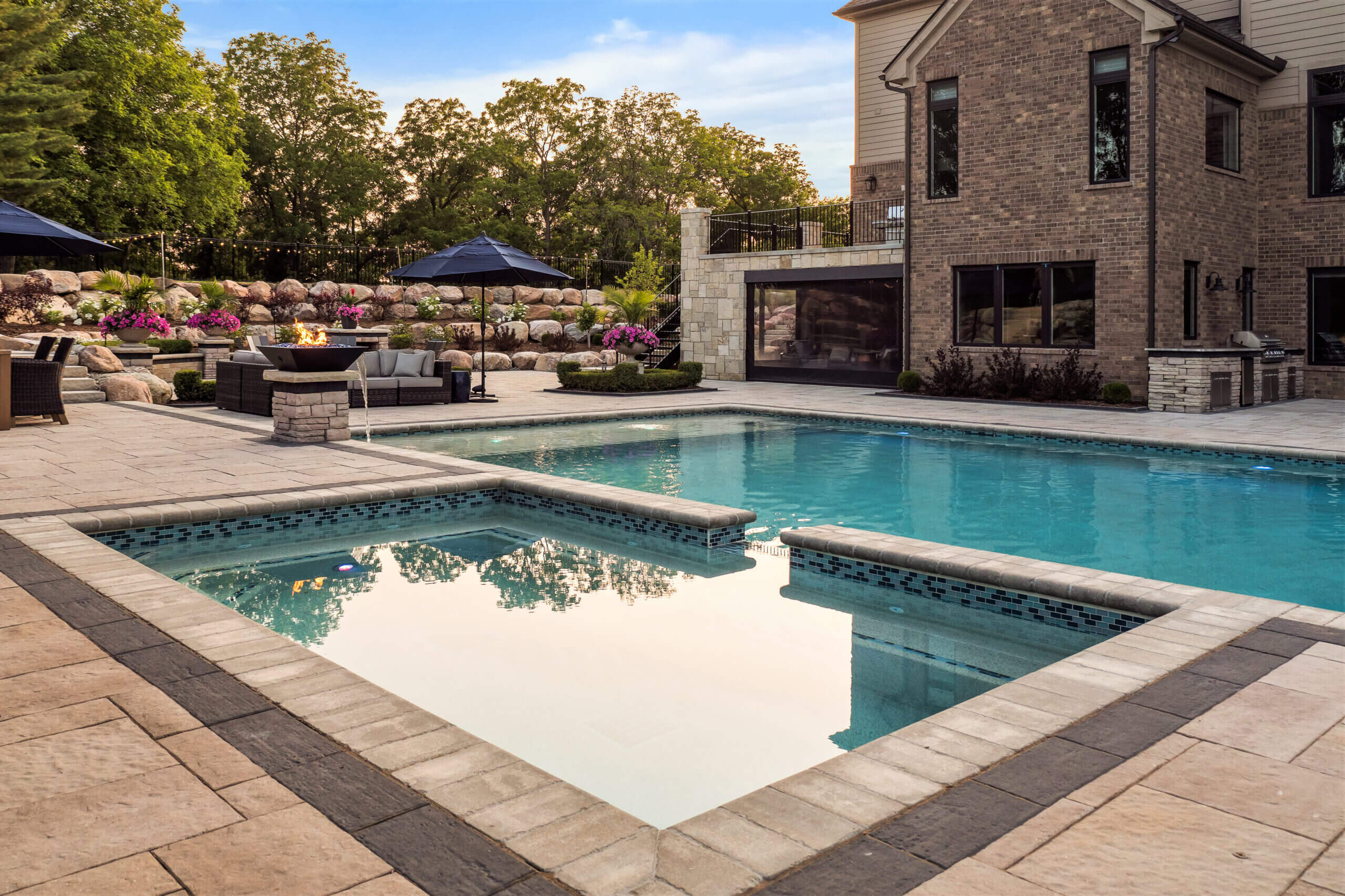 gunite pools, patio pavers, concrete paving, inground pools, pool and spa, fire bowls, patio covers in michigan, patio ideas, pool inspo, gazebos in michigan, cabanas in Michigan, backyard design, backyard landscape design, fire bowls, pool fountains, concrete builders, unilock, outdoor fireplaces in michigan, jacuzzi, outdoor hot tubs, pergola, gazebo, backyard ideas, patio design near me, fire glass, hot tub builder In michigan