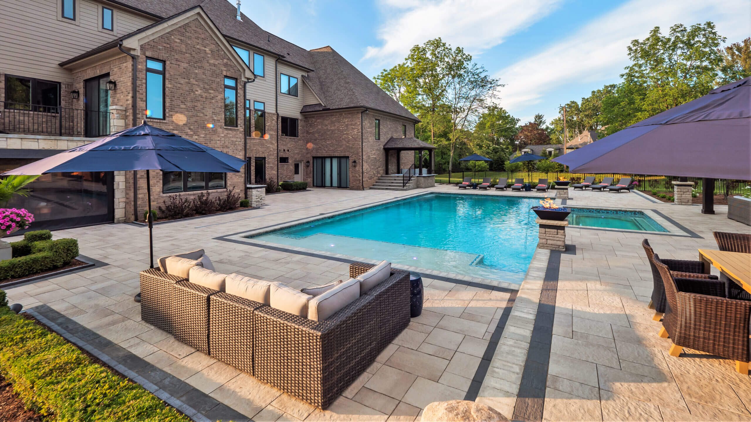 gunite pools, patio pavers, concrete paving, inground pools, pool and spa, fire bowls, patio covers in michigan, patio ideas, pool inspo, gazebos in michigan, cabanas in Michigan, backyard design, backyard landscape design, fire bowls, pool fountains, concrete builders, unilock, outdoor fireplaces in michigan, jacuzzi, outdoor hot tubs, pergola, gazebo, backyard ideas, patio design near me, fire glass, backyard ideas, landscape architecture, landscaping services, outdoor design inspo