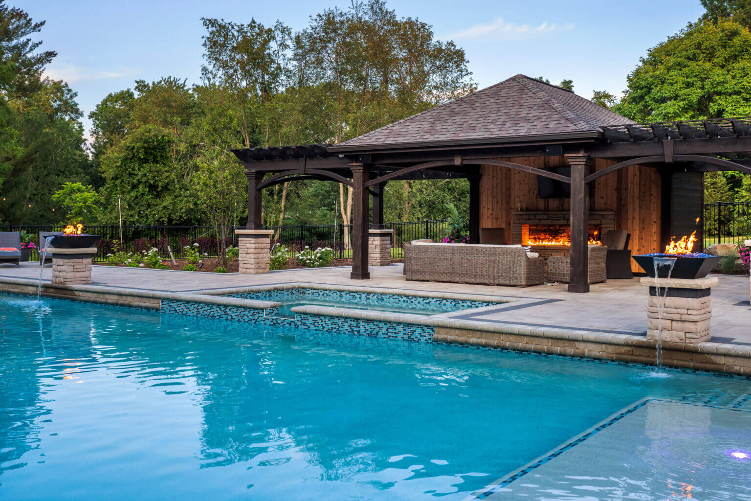gunite pools, patio pavers, concrete paving, inground pools, pool and spa, fire bowls, patio covers in michigan, patio ideas, pool inspo, gazebos in michigan, cabanas in Michigan, backyard design, backyard landscape design